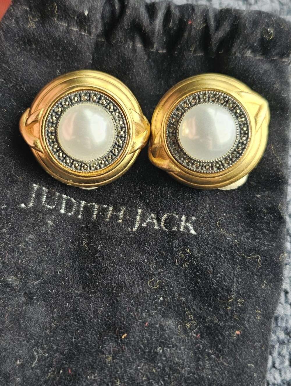 These Judith Jack earrings are sterling silver with a gold vermeil finish and ma
